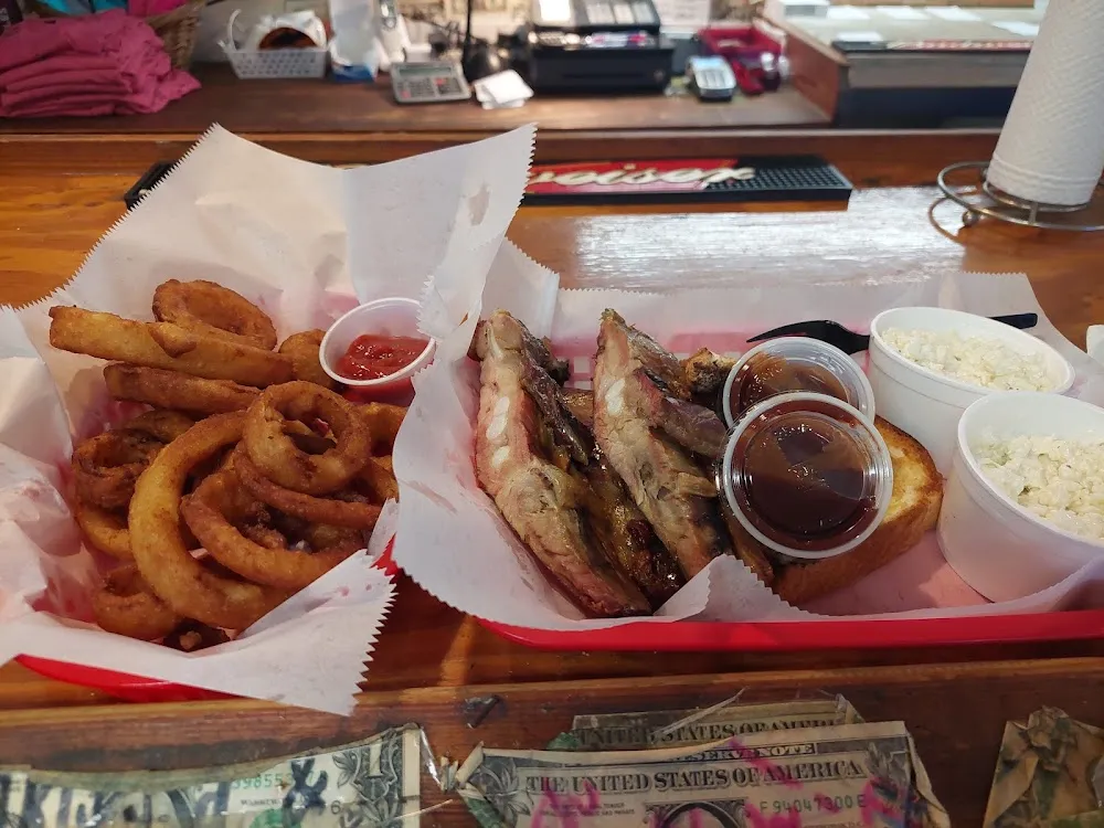 10 99 3 Ribs and 2 Sides Slaw and Onion Rings